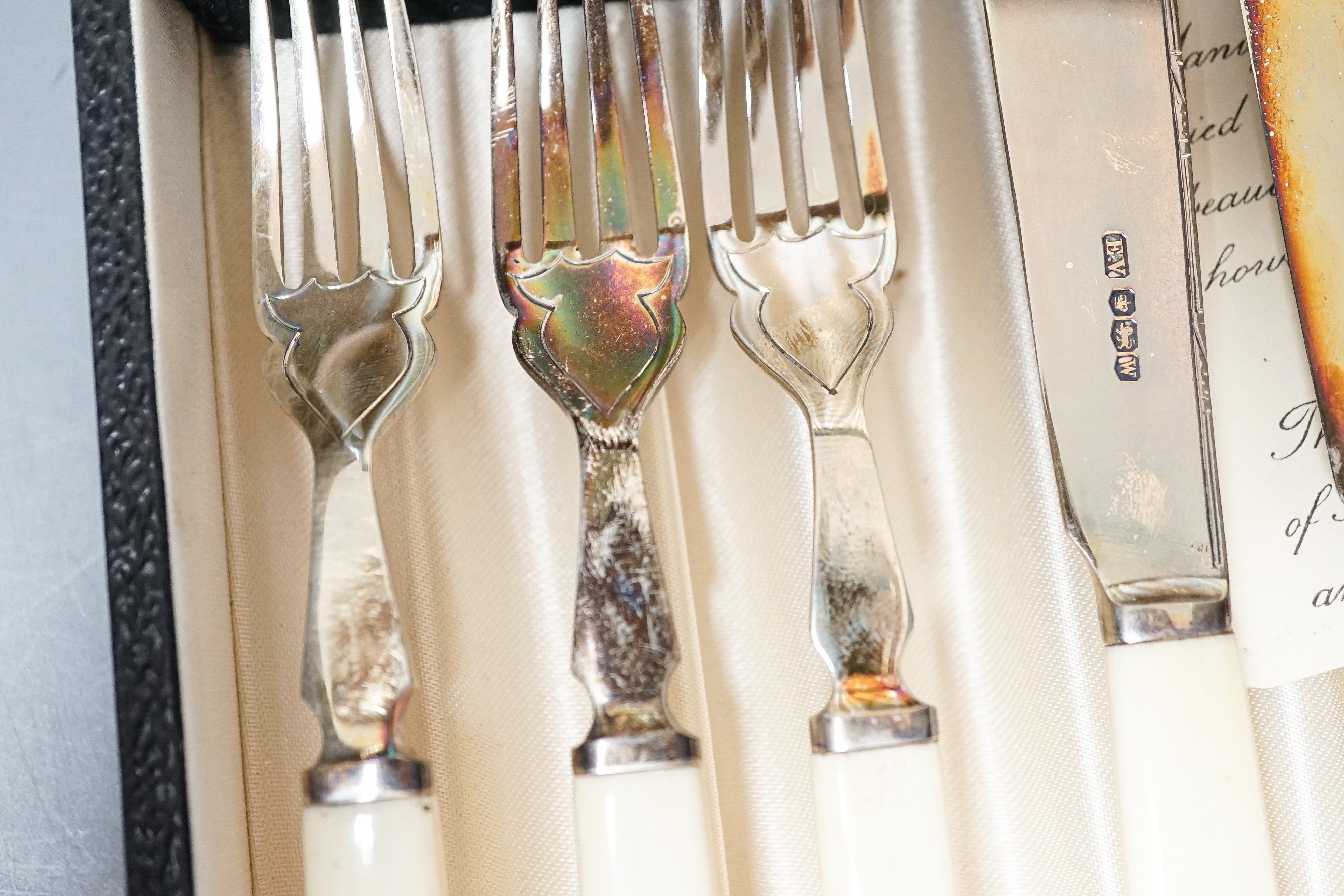 A 1930's cased set of six pairs of ivory handled silver dessert eaters by Viners Ltd, Sheffield, 1936/8/9, gross weight 13.5oz.